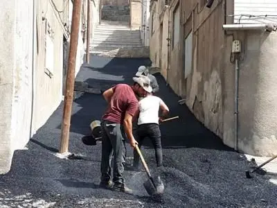 عملیات آسفالت و بهسازی بخش وسیعی از معابر کوی امام سجاد( باغ خلج) 

