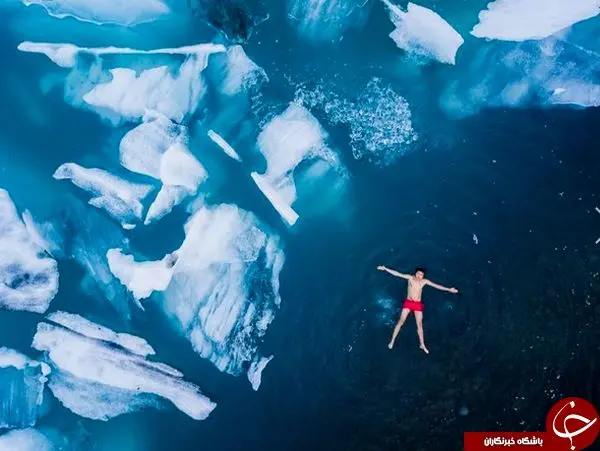 عکس روز نشنال جئوگرافیک از شنای مرگبار در آب‌های منجمد