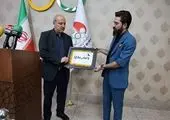 اهتزاز پنج حلقه المپیک در جوار بارگاه ملکوتی امام رضا
